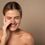 Skin care. Woman with beauty face touching healthy facial skin